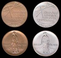 Silver and bronze medallions commemorating Lincoln County centennial, featuring Billy the Kid