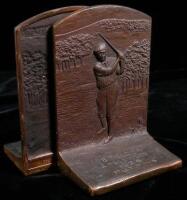 A pair of bronze bookends with matching engraved golfing scene, one titled &ldquo;'98 Field Day, Englewood, 1926, Putting&rdquo;