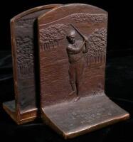 A pair of bronze bookends with matching engraved golfing scene, one titled “'98 Field Day, Englewood, 1926, Putting”