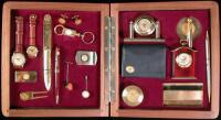 Set of 19 commemorative golf accessories from various sources, including clocks, watches, pens, cuff links, letter opener, tie tack, stick pin, a divit mender, money clip, belt buckle, key chain, wallet, business card holder, etc., individually placed ins