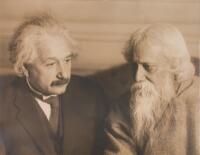 Original gelatin silver print photograph of Albert Einstein with Rabindranath Tagore; signed by Einstein on a card mounted to the verso