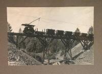 Photograph of North Star Mining Company train on bridge running on an electric rail