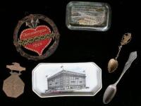 Collection of miscellaneous souvenirs from various World's Fairs, the Pan-Pacific Expo, and other events, including: metal spoons, pins, paper weights, handkerchief, etc.