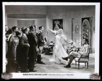 Two movie still photographs from "Page Miss Glory"
