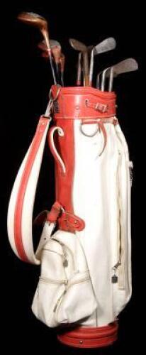 Set of 11 golf clubs with red and white leather caddie bag