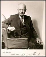 Photograph Signed, of Eisenhower seated in a chair