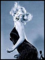 Marilyn Monroe jumping in a black dress