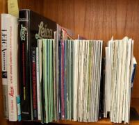 Shelf of Leica magazines, plus a few on photography