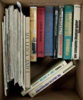 Shelf of photography works, including Leica magazines