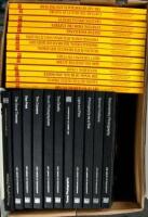 Shelf lot of photography instructional volumes