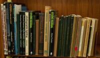 Shelf lot of photography instructional volumes