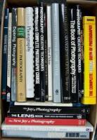 Shelf lot of photography instructional volumes