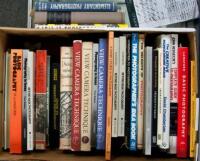Shelf of photography instructional volumes