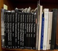 Shelf of photography instruction volumes, many by Ansel Adams