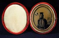Tintype photograph of a plains Indian in full regalia