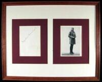 Signature of Amelia Earhart, framed with a halftone portrait of her,