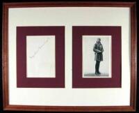 Signature of Amelia Earhart, framed with a halftone portrait of her,