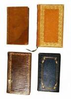 Lot of four miniature books.
