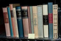 Shelf of illustrated works published by Heritage Press