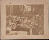 Original albumen photograph of a team inspecting the mummified remains of a person