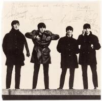 Halftone photograph of all four Beatles, signed by each of them, and inscribed to Liberace ("Liber-archie")