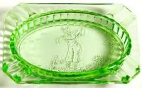 Green glass ashtray with golfer illustration