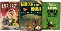 Three paperback golf mystery novels