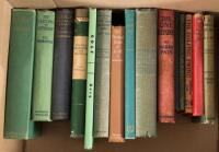 Shelf of fifteen volumes about golf