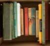 Shelf of thirteen books on golf and sporting