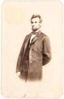 Carte-de-visite photograph of Abraham Lincoln standing, one arm behind his back