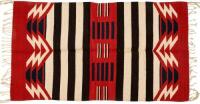 Chimayo weaving with a rich red field and brown and white stripes, in the classic Rio Grande tradition
