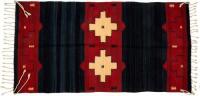 Chimayo weaving with ivory geometric designs against a rich red field