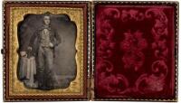 Cased daguerreotype of a man posing with a book