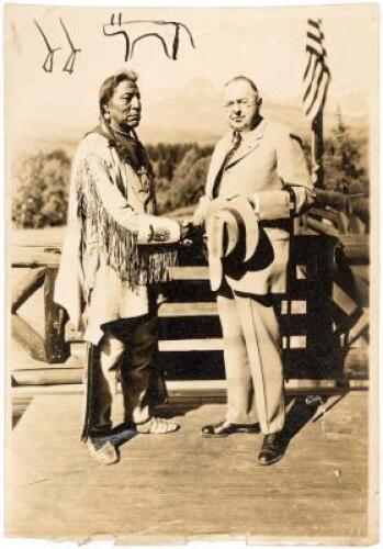 Photograph of Chief Two Guns White Calf, model for the Indian head on the buffalo nickel, signed by him with a pictograph