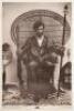 Large poster of Huey P. Newton for the Black Panthers - the famous photograph of him seated in a wicker chair with two weapons
