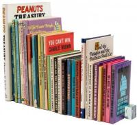 Lot of thirty Peanuts books - including one signed by Charles Schulz