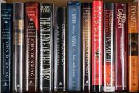 Shelf of works by John Dunning, Louis de Bernières and Robert Harris