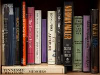 Shelf of modern literature, including John Updike