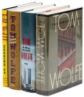Four first editions by Tom Wolfe, signed