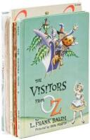 Seven volumes of Oziana, by L. Frank Baum or W. W. Denslow