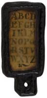 Small English hornbook with leather case surrounding the transparent horn cover