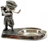 Ashtray with golfer in the midst of a back swing