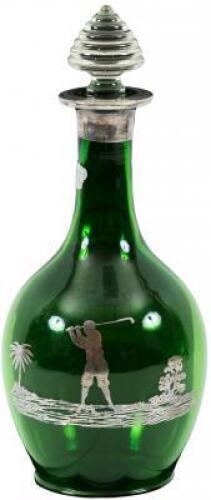 Green glass decanter, with sterling silver overlay showing a tropical golfing scene