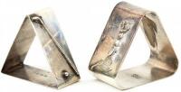 Two triangular napkin holders, one being sterling silver