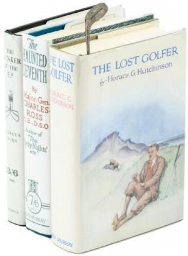 Small collection of golf books and a pin