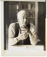 Three large portrait photographs of Henry Miller