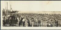 Panoramic photograph "Mary Pickford presents the Flag to her Regiment of 'He Men' and the Regimental Band plays the National Anthem, Camp Kearny, Feb. 9, 1918"