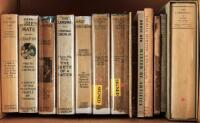 Shelf of fourteen miscellaneous volumes