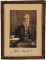 Photograph of John Muir, signed by him in ink beneath the image