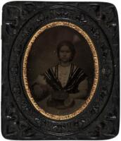 Ambrotype of woman with hat on her lap, in novelty "look-in" thermoplastic case